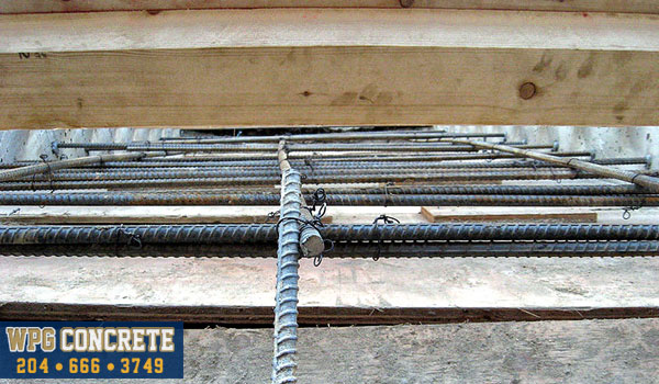 Rebar reinforcements in place for exposed aggregate concrete in Winnipeg, Manitoba